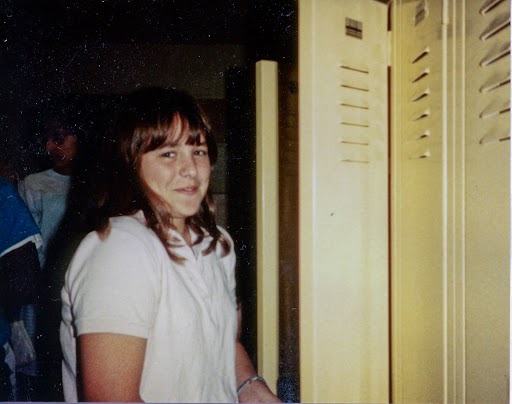 Smiling girl at locker
