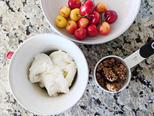 Fresh cherries, Greek yogurt, and granola