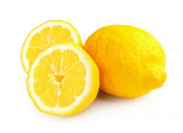 Fresh ripe lemons isolated on white background. Lemon in a cut. Half of lemon.